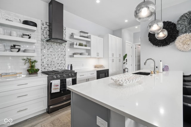 15 W Executive Dr Unit 101, Carmel, IN 46032 - kitchen with range with gas cooktop, open shelves, wall chimney range hood, a sink, and decorative backsplash