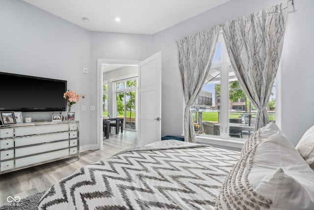 15 W Executive Dr Unit 101, Carmel, IN 46032 - bedroom with wood finished floors, recessed lighting, and baseboards