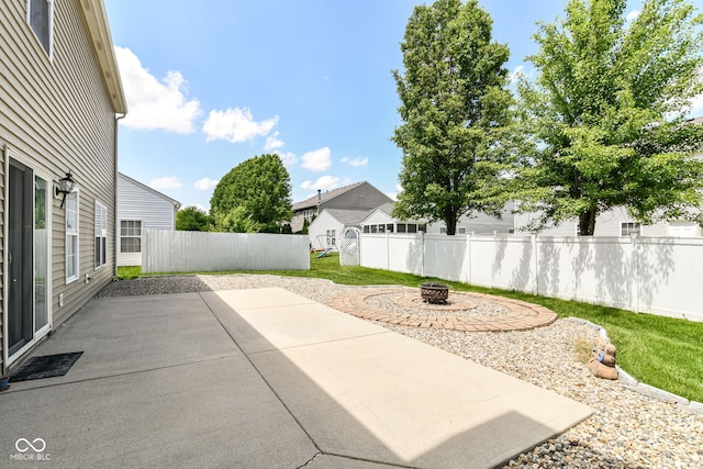 12612 Majestic Way, Fishers, IN 46037 - fenced backyard featuring an outdoor fire pit and a patio