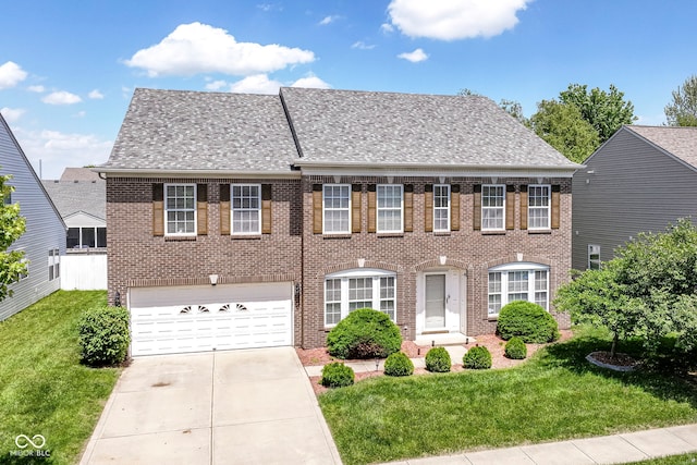 12612 Majestic Way, Fishers, IN 46037 - view of front of house featuring brick siding, a front lawn, a garage, driveway, and a shingled roof