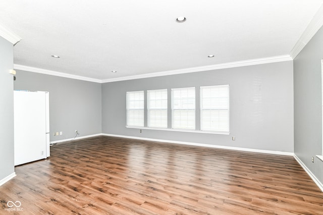 12612 Majestic Way, Fishers, IN 46037 - empty room with crown molding, wood finished floors, baseboards, and recessed lighting