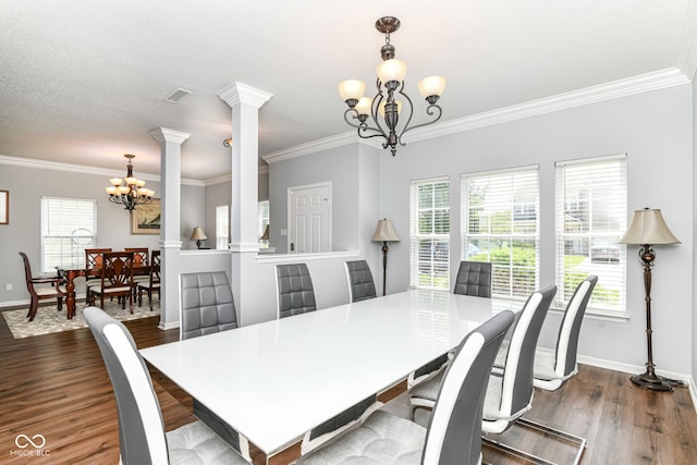 12612 Majestic Way, Fishers, IN 46037 - dining room with a chandelier, ornate columns, ornamental molding, wood finished floors, and baseboards
