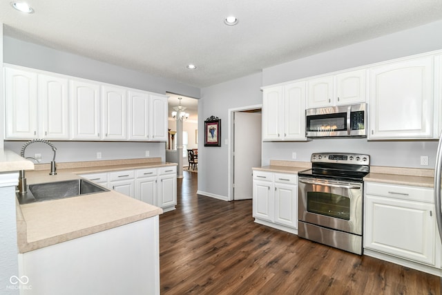 12612 Majestic Way, Fishers, IN 46037 - kitchen featuring stainless steel appliances, a sink, dark wood-style flooring, recessed lighting, and white cabinets