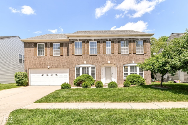 12612 Majestic Way, Fishers, IN 46037 - view of front facade featuring a garage, concrete driveway, a front lawn, and brick siding