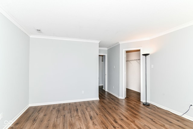 12612 Majestic Way, Fishers, IN 46037 - unfurnished bedroom featuring ornamental molding, wood finished floors, baseboards, a spacious closet, and a closet