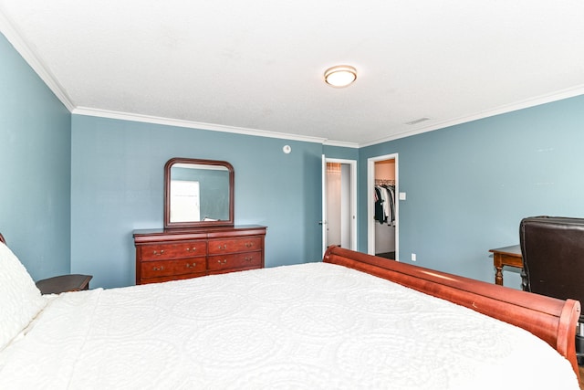12612 Majestic Way, Fishers, IN 46037 - bedroom featuring ornamental molding, a walk in closet, and a closet