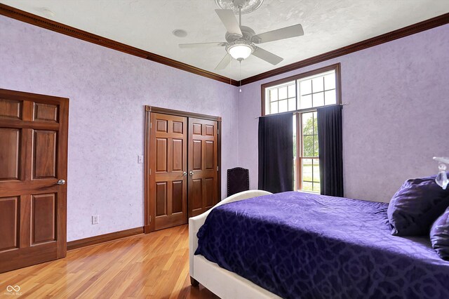 893 W 500 S, Anderson, IN 46013 - bedroom featuring light wood-style floors, crown molding, a ceiling fan, and baseboards