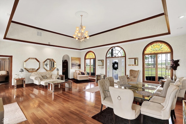 893 W 500 S, Anderson, IN 46013 - dining space featuring a chandelier, arched walkways, crown molding, wood finished floors, and a tray ceiling