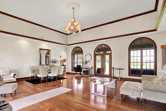893 W 500 S, Anderson, IN 46013 - living area featuring a chandelier, arched walkways, wood finished floors, and crown molding