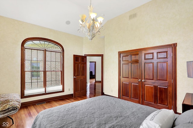 893 W 500 S, Anderson, IN 46013 - bedroom with a chandelier, wood finished floors, baseboards, and a towering ceiling