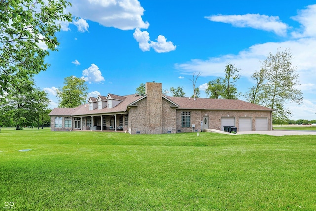 893 W 500 S, Anderson, IN 46013 - rear view of property with an attached garage, a lawn, a chimney, and driveway