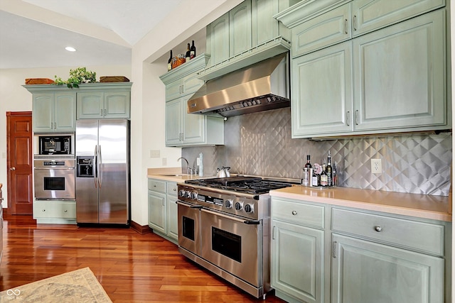 893 W 500 S, Anderson, IN 46013 - kitchen featuring appliances with stainless steel finishes, green cabinetry, under cabinet range hood, wood finished floors, and light countertops