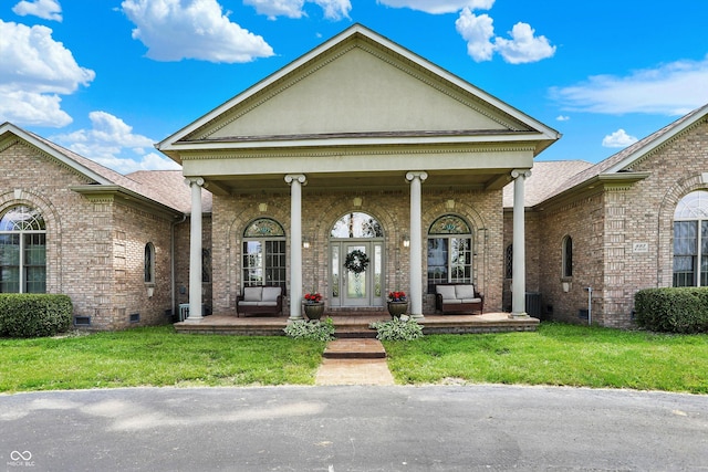 893 W 500 S, Anderson, IN 46013 - view of front of house featuring crawl space, a porch, brick siding, and a front yard