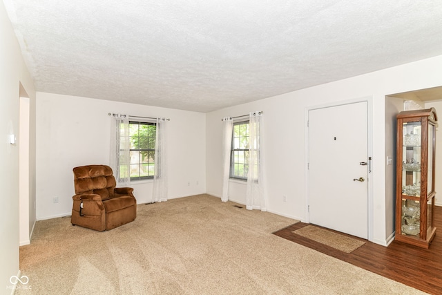 4504 Harvard Dr, Anderson, IN 46013 - unfurnished room with a textured ceiling, baseboards, and carpet