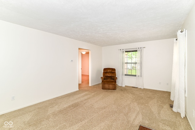 4504 Harvard Dr, Anderson, IN 46013 - carpeted spare room featuring a textured ceiling and baseboards