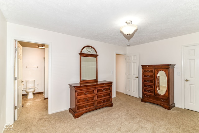 4504 Harvard Dr, Anderson, IN 46013 - bedroom featuring light carpet, ensuite bathroom, a textured ceiling, and baseboards
