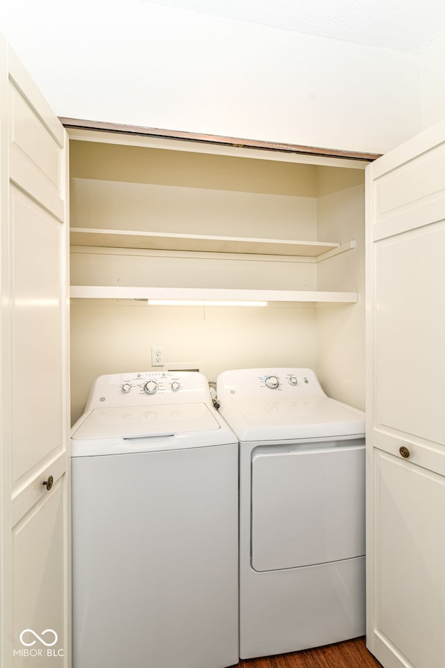 4504 Harvard Dr, Anderson, IN 46013 - washroom featuring washing machine and dryer and dark wood-style floors