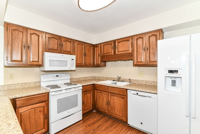 4504 Harvard Dr, Anderson, IN 46013 - kitchen with white appliances, a sink, light countertops, brown cabinetry, and a textured ceiling