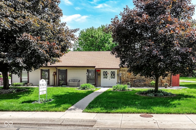 4504 Harvard Dr, Anderson, IN 46013 - view of front of property featuring a front lawn, stone siding, and a shingled roof