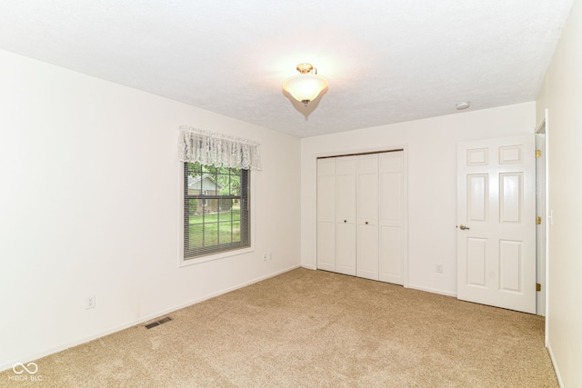 4504 Harvard Dr, Anderson, IN 46013 - unfurnished bedroom with carpet floors, a closet, and baseboards