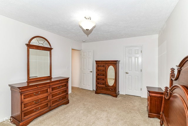 4504 Harvard Dr, Anderson, IN 46013 - bedroom with light carpet, a textured ceiling, and baseboards