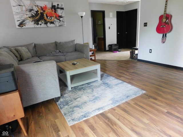 1612 Prairieview Ln, Greenfield, IN 46140 - living area with wood finished floors and baseboards