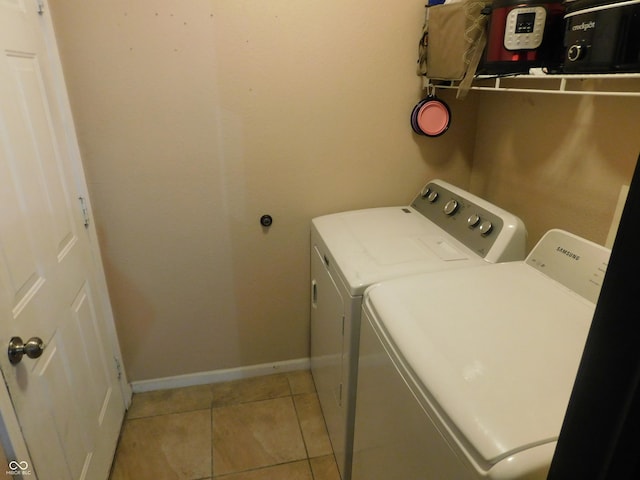 1612 Prairieview Ln, Greenfield, IN 46140 - washroom featuring washing machine and clothes dryer and light tile patterned floors