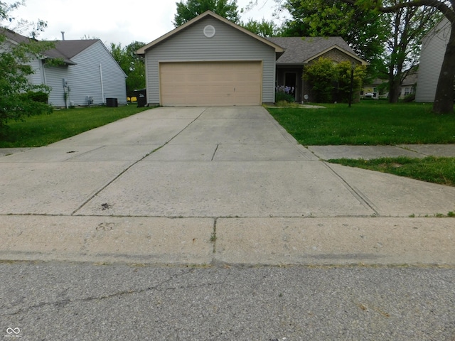 1612 Prairieview Ln, Greenfield, IN 46140 - view of front of house featuring a front lawn, a garage, and concrete driveway