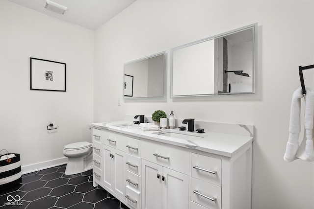 2024 Yandes St, Indianapolis, IN 46202 - full bathroom with toilet, double vanity, baseboards, and tile patterned floors