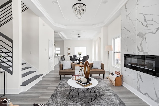 2024 Yandes St, Indianapolis, IN 46202 - living area featuring a raised ceiling, a chandelier, stairs, and wood finished floors