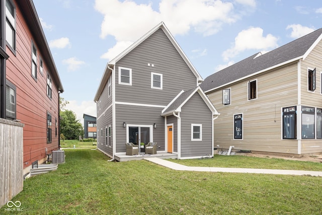 2024 Yandes St, Indianapolis, IN 46202 - rear view of house with a lawn, central AC, an outdoor living space, and a patio area