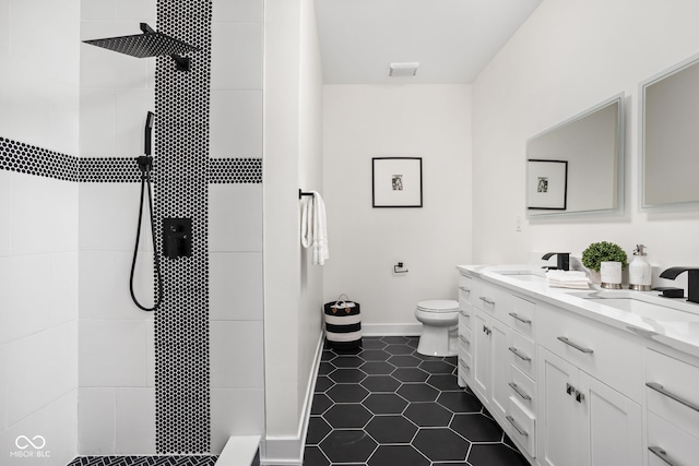 2024 Yandes St, Indianapolis, IN 46202 - full bathroom with toilet, tile patterned floors, a tile shower, and double vanity