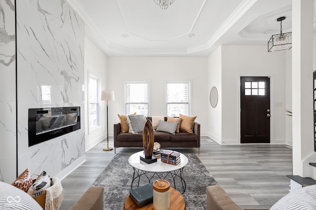 2024 Yandes St, Indianapolis, IN 46202 - living area with plenty of natural light, a raised ceiling, wood finished floors, and crown molding