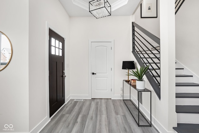 2024 Yandes St, Indianapolis, IN 46202 - foyer featuring stairway, wood finished floors, baseboards, and a chandelier