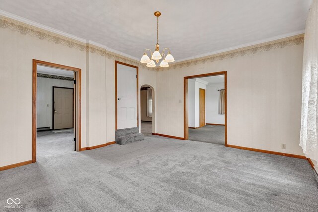 1437 S 725 W, Tipton, IN 46072 - spare room featuring arched walkways, a chandelier, carpet, ornamental molding, and baseboards