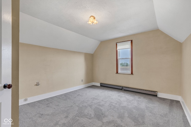 1437 S 725 W, Tipton, IN 46072 - additional living space with baseboard heating, vaulted ceiling, carpet, and baseboards