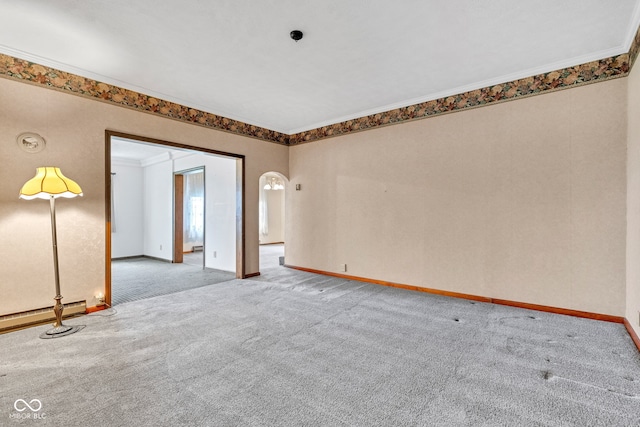 1437 S 725 W, Tipton, IN 46072 - carpeted empty room featuring baseboards, a baseboard heating unit, ornamental molding, and arched walkways