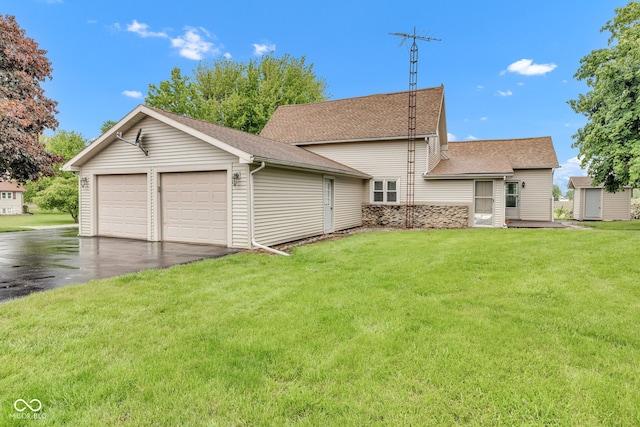 1437 S 725 W, Tipton, IN 46072 - back of property featuring an outdoor structure, a lawn, and a shingled roof