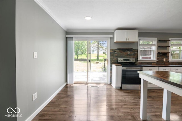 953 W Clinton St, Danville, IN 46122 - kitchen featuring stainless steel range with electric stovetop, crown molding, white cabinets, wood finished floors, and baseboards