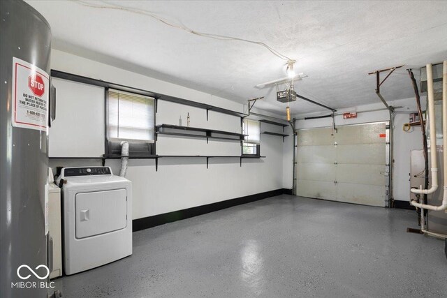953 W Clinton St, Danville, IN 46122 - garage featuring a garage door opener, water heater, and baseboards