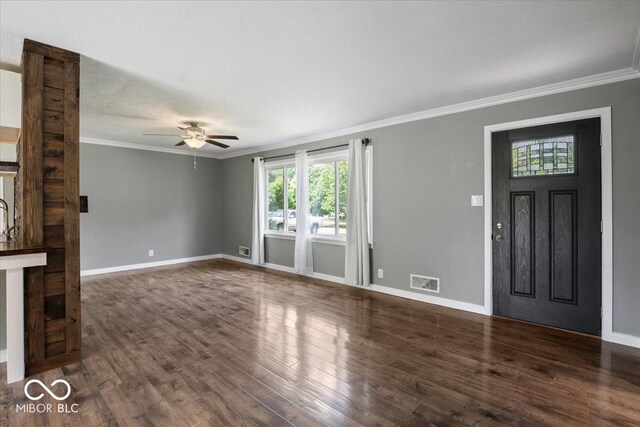953 W Clinton St, Danville, IN 46122 - unfurnished living room featuring crown molding, ceiling fan, wood finished floors, and baseboards