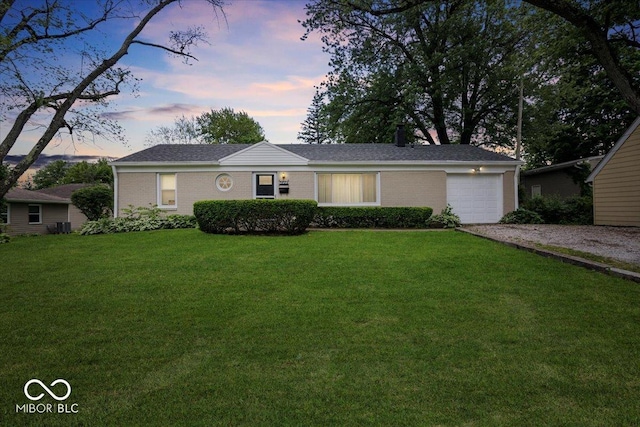 953 W Clinton St, Danville, IN 46122 - ranch-style home featuring driveway, a garage, a yard, and brick siding
