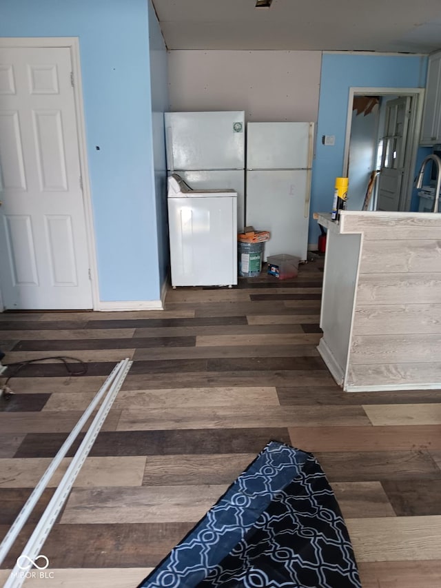4106 N Pasadena Ave, Indianapolis, IN 46226 - kitchen featuring freestanding refrigerator, washer / dryer, wood finished floors, and a sink