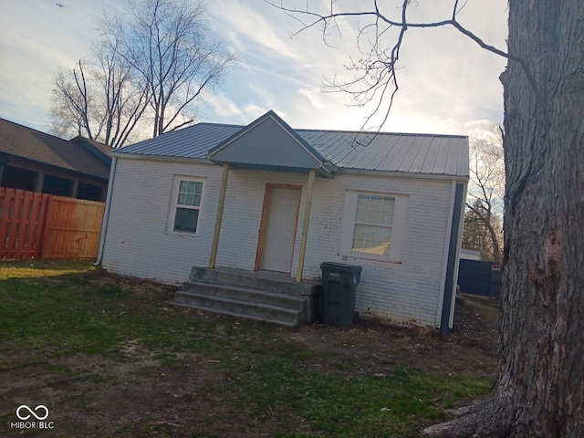 4106 N Pasadena Ave, Indianapolis, IN 46226 - view of front of home featuring brick siding and metal roof
