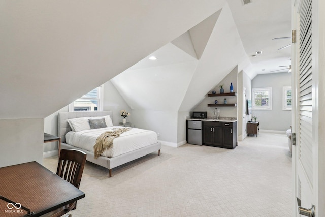 1616 N Delaware St, Indianapolis, IN 46202 - bedroom with lofted ceiling, light colored carpet, bar with sink, baseboards, and recessed lighting