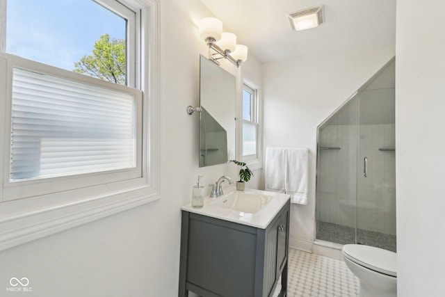 1616 N Delaware St, Indianapolis, IN 46202 - full bathroom featuring healthy amount of natural light, vanity, a shower stall, and toilet