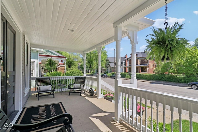 1616 N Delaware St, Indianapolis, IN 46202 - view of patio / terrace with a porch and a residential view