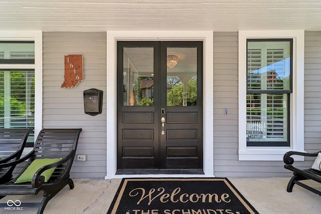 1616 N Delaware St, Indianapolis, IN 46202 - view of exterior entry featuring french doors and a porch