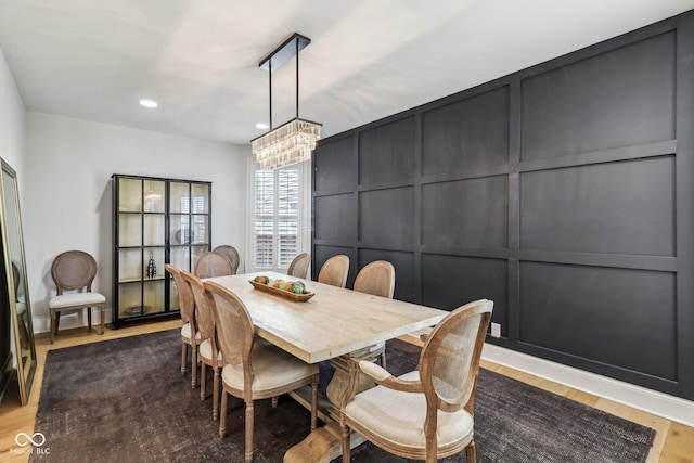 1616 N Delaware St, Indianapolis, IN 46202 - dining space featuring a decorative wall, a chandelier, wood finished floors, and recessed lighting