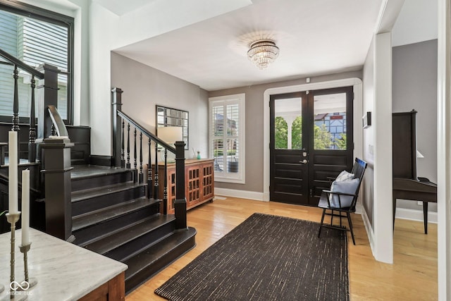 1616 N Delaware St, Indianapolis, IN 46202 - entryway with stairs, baseboards, and light wood-type flooring